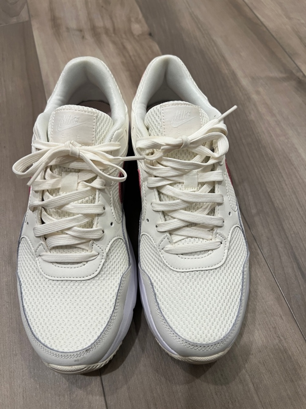 Nike Women’s Cream White Athletic Sneakers with Subtle Pink Swoosh